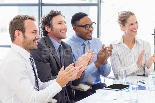 Businesspeople applauding while in a meeting Stock photo © wavebreak_media