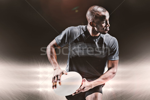 Obraz sportowiec uruchomiony rugby ball Spotlight Zdjęcia stock © wavebreak_media