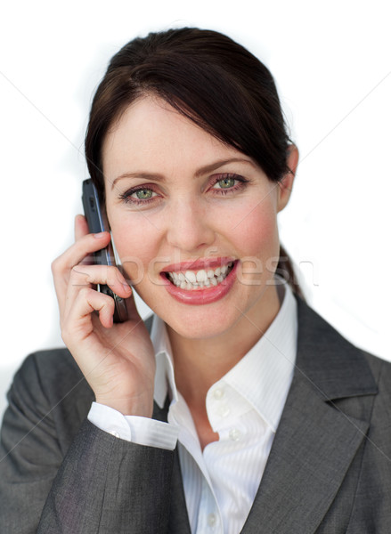 Captivating businesswoman using a mobile phone Stock photo © wavebreak_media
