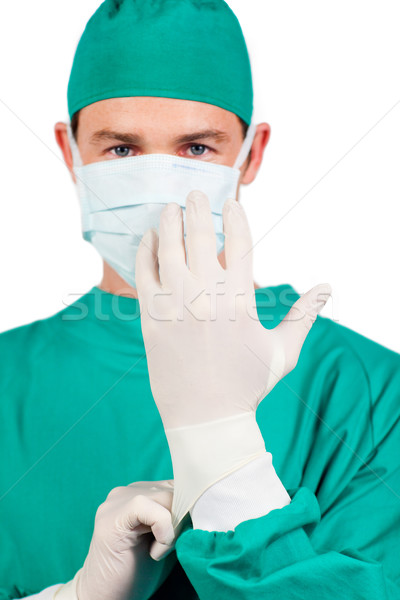 Young surgeon putting his glover Stock photo © wavebreak_media
