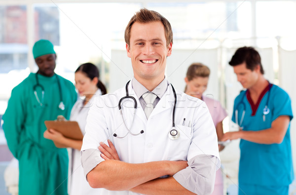 Stock photo: Doctor with colleagues in the background