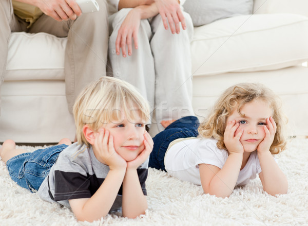 Stock photo: Adorable family watching tv in the living room