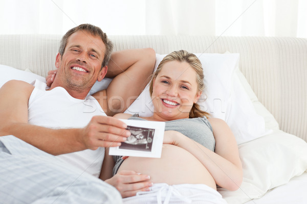 Parents regarder xray maison sourire heureux [[stock_photo]] © wavebreak_media