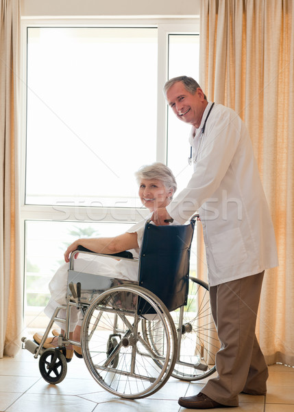 Stock photo: Doctor with his patient looking at the camera