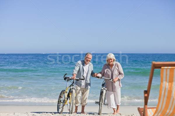 Stock fotó: Idős · pár · biciklik · tengerpart · tenger · egészség