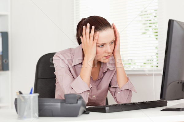 A stressed businesswoman is looking to the screen of her pc in an office Stock photo © wavebreak_media