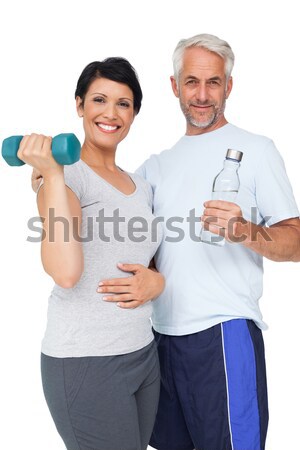 Fit couple going to practice yoga against a white background Stock photo © wavebreak_media