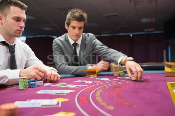 Man placing bet im poker game at casino Stock photo © wavebreak_media