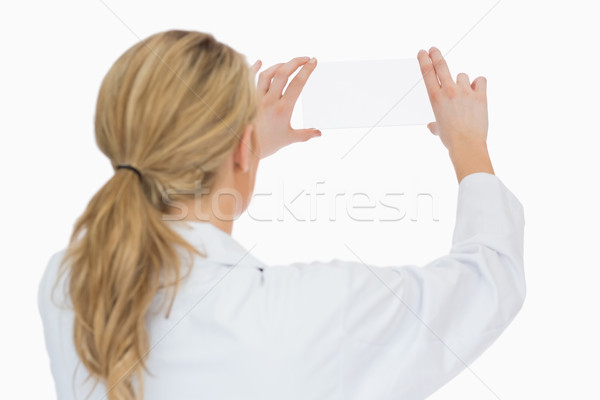 Female doctor looking at blank pane from behind Stock photo © wavebreak_media