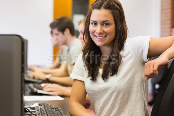 Student sitting at the computer room while smiling in college Stock photo © wavebreak_media