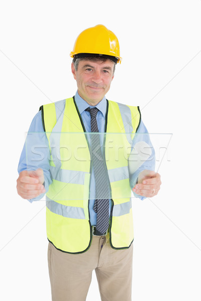 Architect smiling while holding a huge glass slide  Stock photo © wavebreak_media