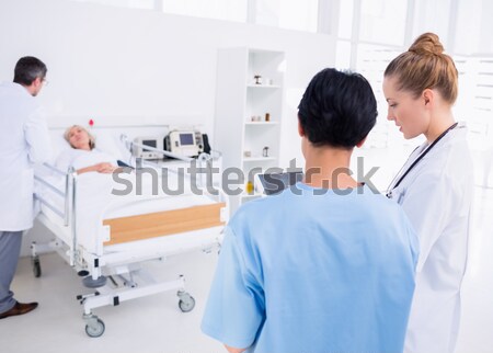 Doctor and male nurse in a hospital room Stock photo © wavebreak_media