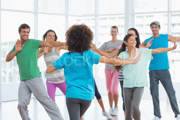 Stock photo: Fitness class and instructor doing pilates exercise