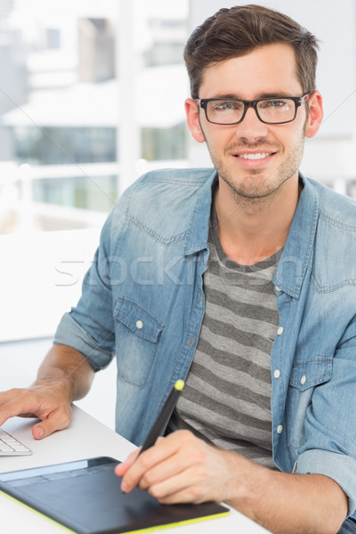 Casual male photo editor using graphics tablet Stock photo © wavebreak_media