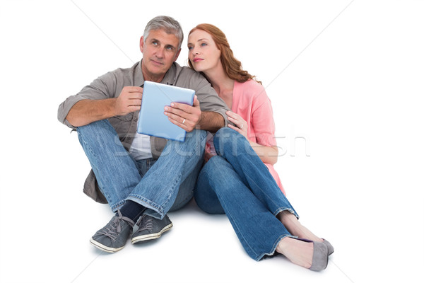 Casual couple sitting using tablet Stock photo © wavebreak_media