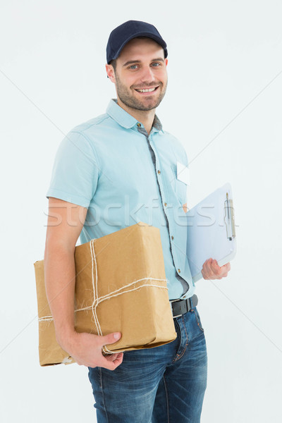 Portrait of happy courier man with parcel Stock photo © wavebreak_media