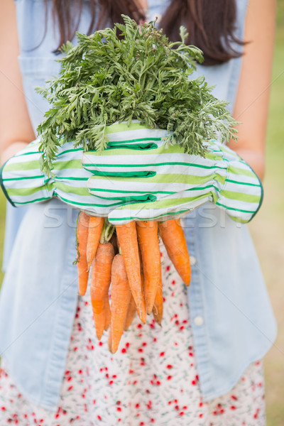 Woman holding her organic carrots Stock photo © wavebreak_media
