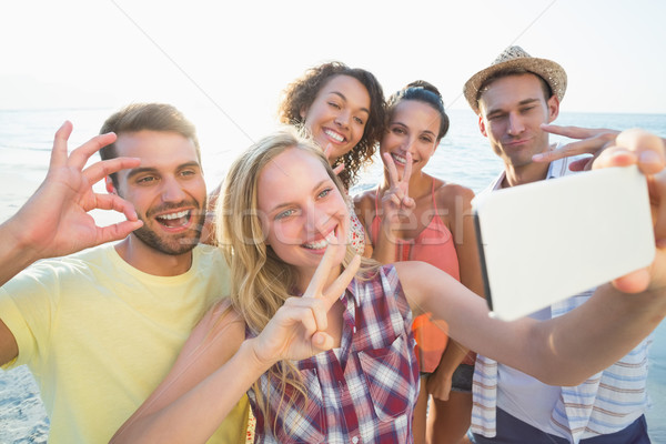 group of friends taking selfies  Stock photo © wavebreak_media