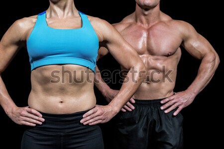 Muscular couple with hands on the hips  Stock photo © wavebreak_media