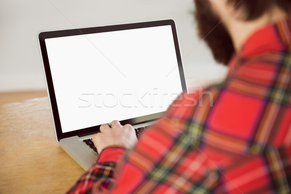 Hipster businessman working on his laptop Stock photo © wavebreak_media