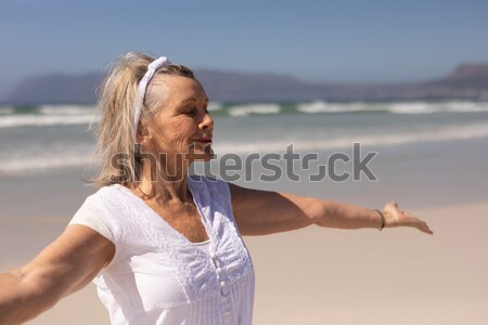 Close up of senior woman meditating at beach Stock photo © wavebreak_media