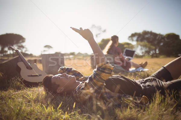 若い男 携帯電話 草で覆われた フィールド 空 少女 ストックフォト © wavebreak_media