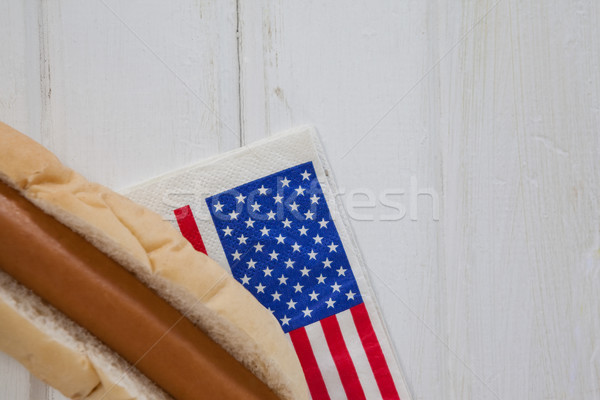 Hot dog and American flag on white wooden table Stock photo © wavebreak_media