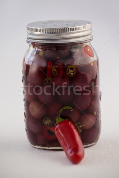 Close up of red olives with jalapeno in container Stock photo © wavebreak_media