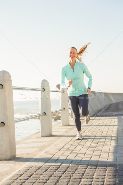 Mosolyog fitt szőke nő jogging promenád napos idő Stock fotó © wavebreak_media