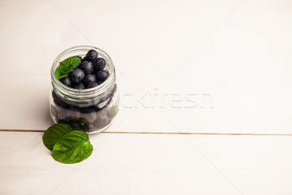Vetro jar fresche mirtilli tavolo in legno Foto d'archivio © wavebreak_media