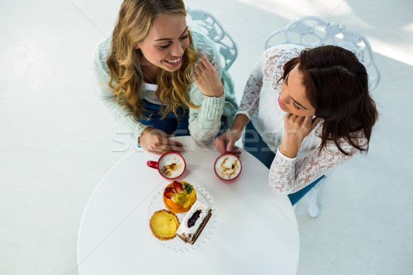 two girls drink coffee Stock photo © wavebreak_media