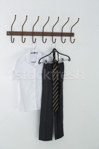 Formal shirt, tie and pants hanging on hook Stock photo © wavebreak_media