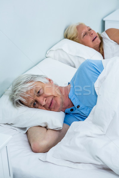 Senior homem relaxante cama mulher Foto stock © wavebreak_media