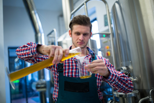 Brewer pouring beer in pint glass Stock photo © wavebreak_media