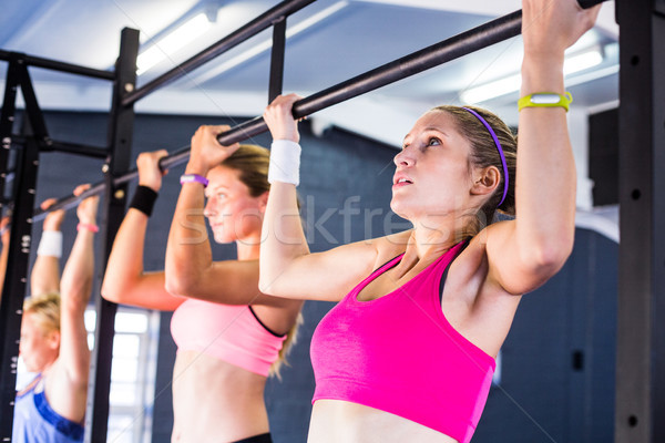 People doing chin-ups in gym Stock photo © wavebreak_media