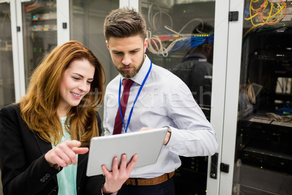 Technicians using digital tablet while analyzing server Stock photo © wavebreak_media