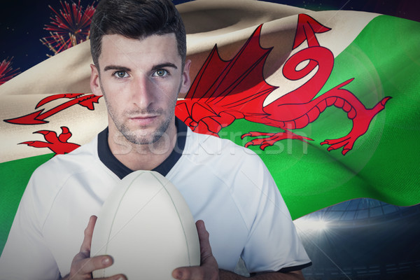 Stock photo: Composite image of portrait of a player holding rugby ball