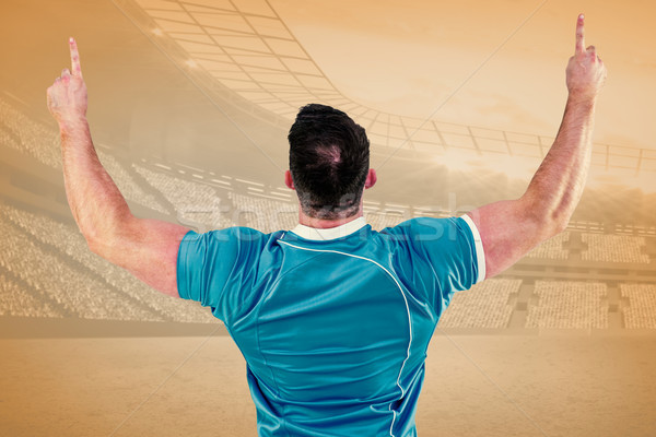 Composite image of rugby player cheering and pointing Stock photo © wavebreak_media