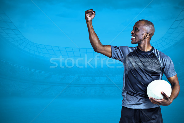 Composite image of sportsman with clenched fist after victory Stock photo © wavebreak_media