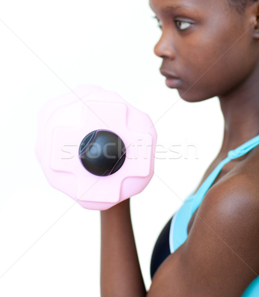 Pretty woman working out with dumbbell  Stock photo © wavebreak_media