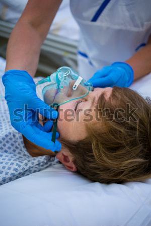 Doctor putting oxygen mask on a patient Stock photo © wavebreak_media