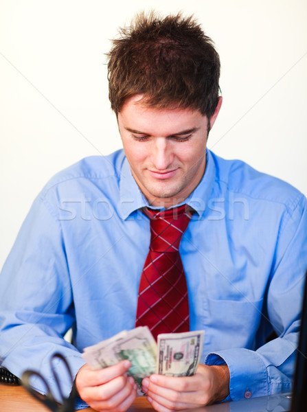 Businessman counting money Stock photo © wavebreak_media