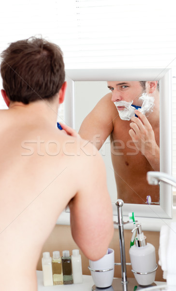 Handsome caucasian man shaving in the bathroom at home Stock photo © wavebreak_media