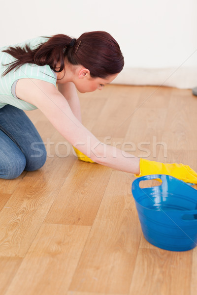 Beautiful red-haired female using a saw for diy at home Stock photo © wavebreak_media