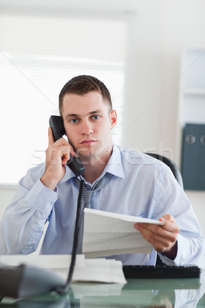 Close up of young businessman calling the author of a letter Stock photo © wavebreak_media