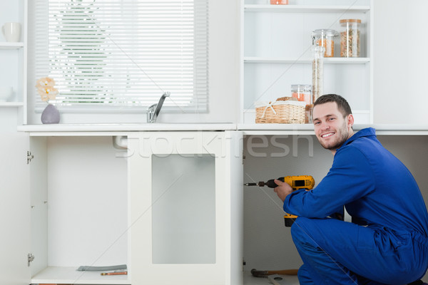 Boldog ezermester megjavít ajtó konyha építkezés Stock fotó © wavebreak_media