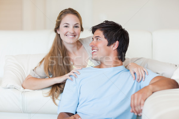Charming couple watching television in their living room Stock photo © wavebreak_media