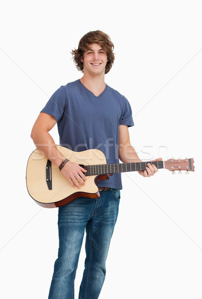 Männlich Studenten posiert halten Gitarre weiß Stock foto © wavebreak_media