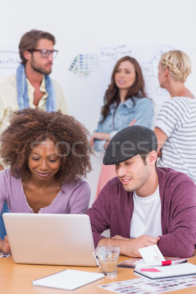 Team of designers and editors working and chatting Stock photo © wavebreak_media