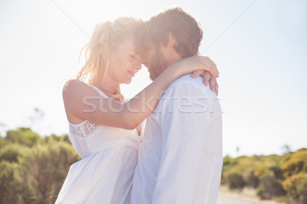 Attractive couple embracing by the road Stock photo © wavebreak_media
